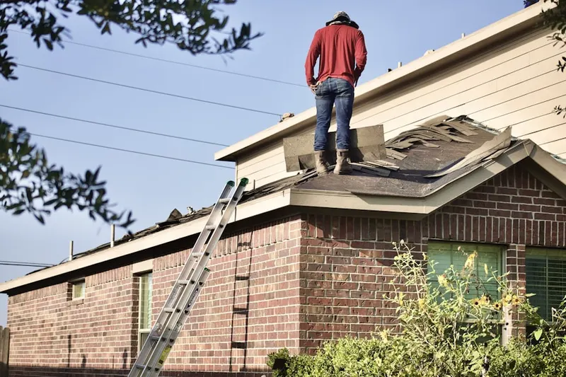 Professional roofer working on a residential roof in Lake Wisconsin